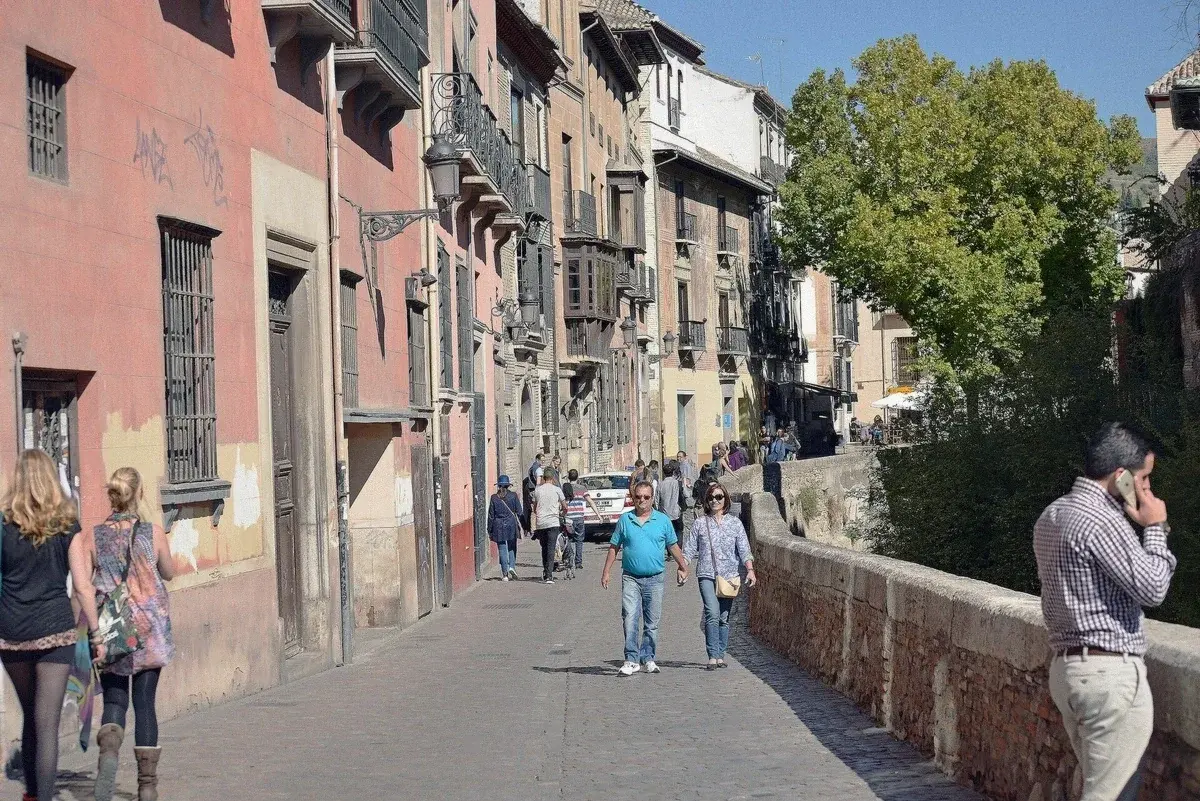 The Carrera del Darro street running beneath the Alhambra walls in Granada, Spain